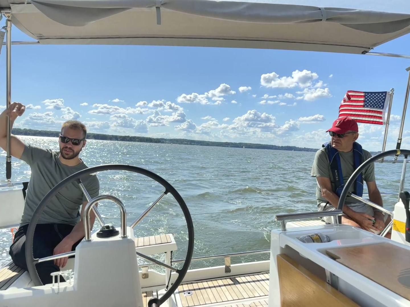 Two sailors at the helm
